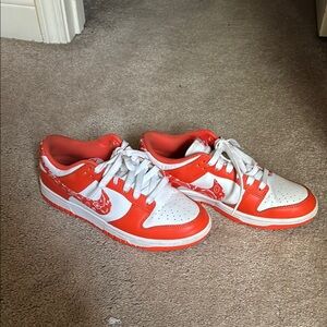 Orange and white Nike dunks